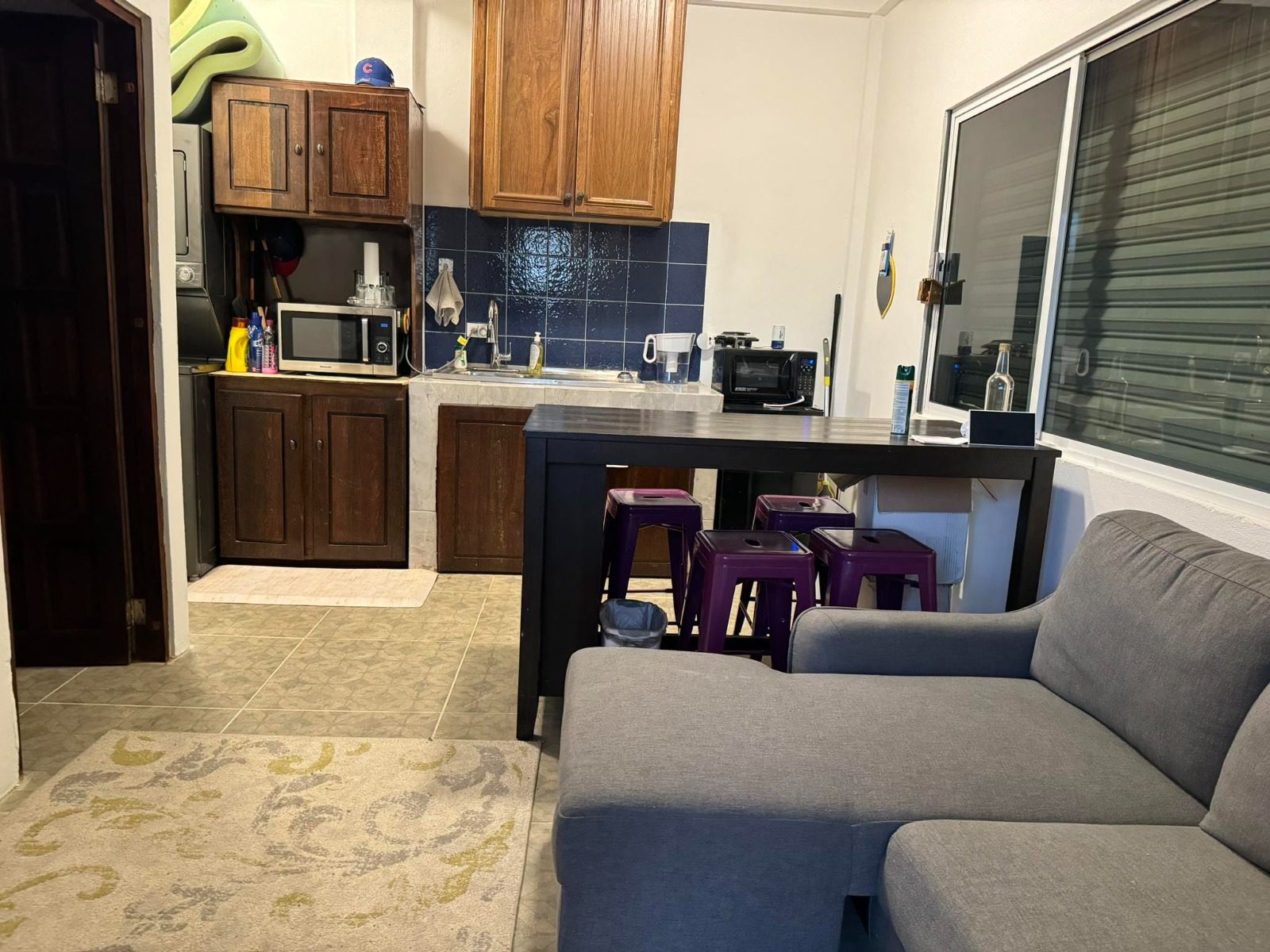 The Texas apartment kitchen and living area